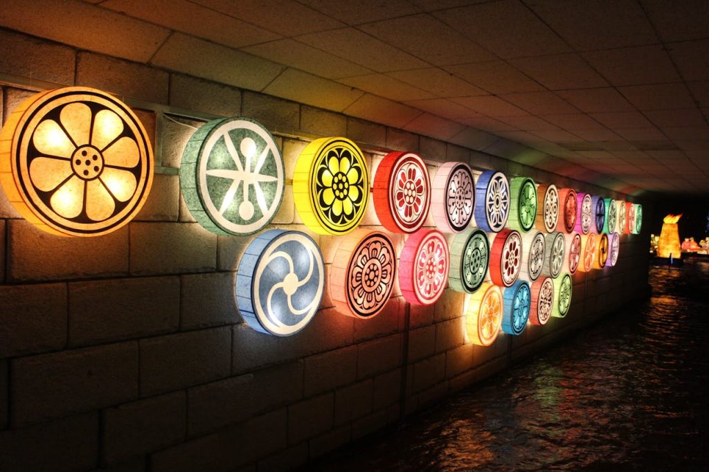 Colorful lanterns beautifully illuminated at night along Cheonggyecheon Stream in Seoul.